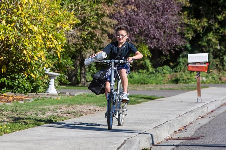 A person riding a bicycle 
Description automatically generated with medium confidence